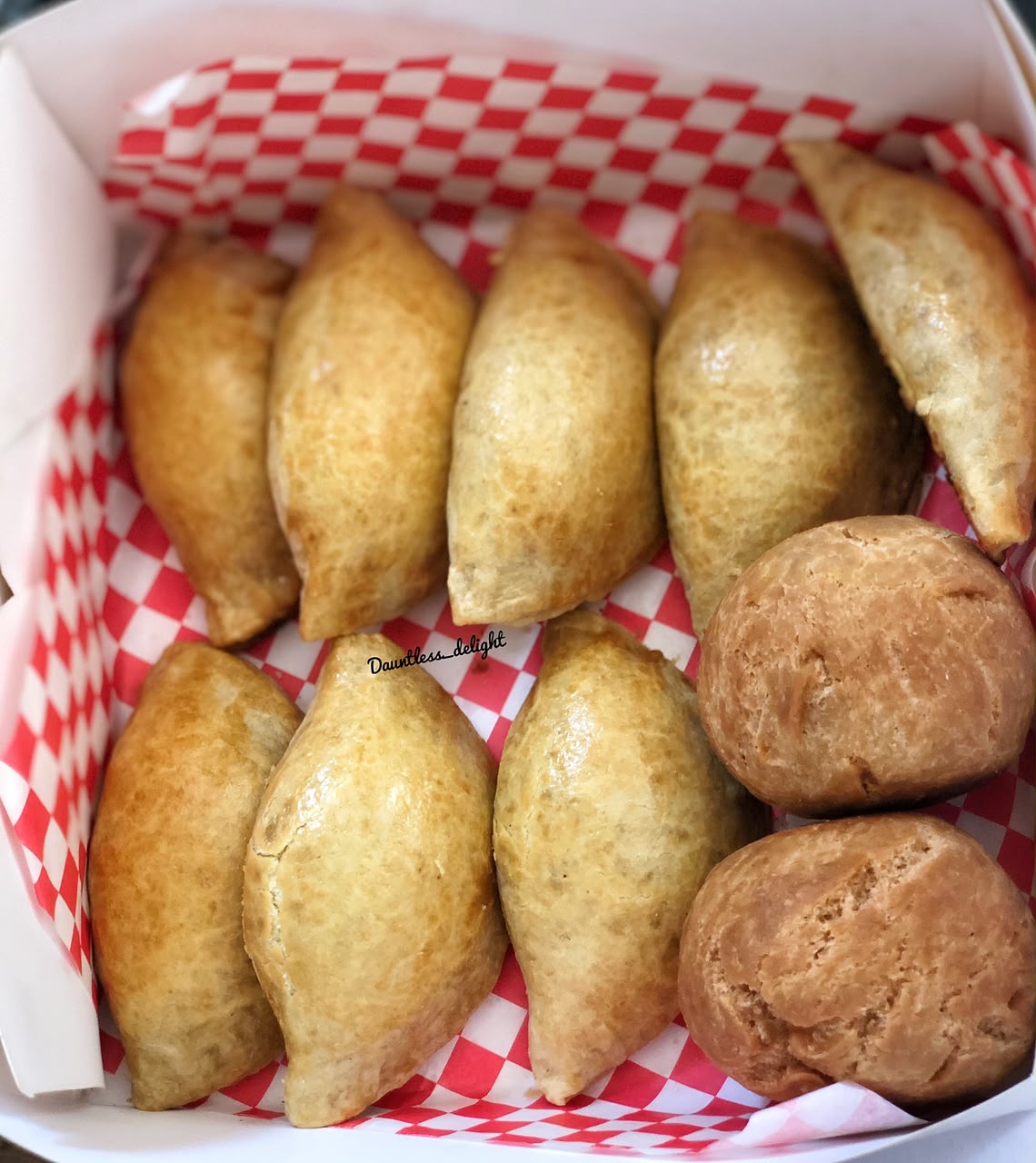 Box of freshly baked meat pies and puff pastry
