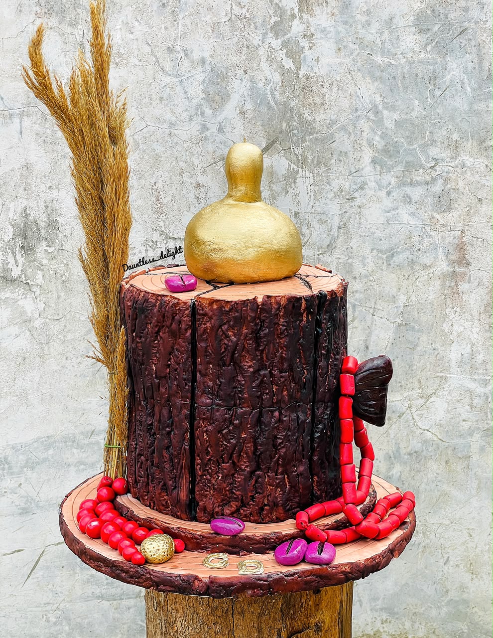 Traditional Yoruba themed cake with gourd, beads and tree bark texture