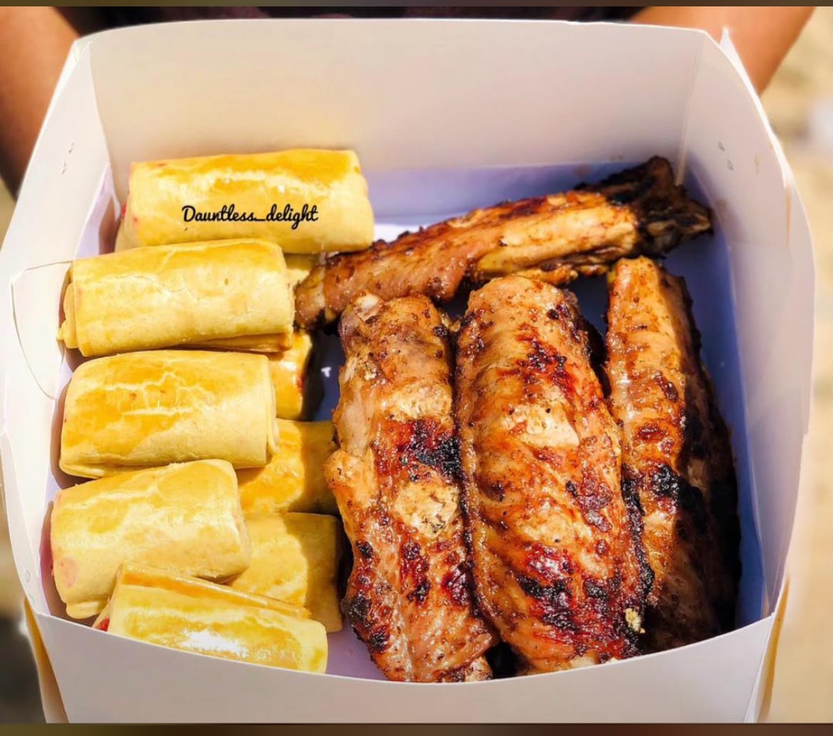 Box of sausage rolls with grilled peppered chicken
