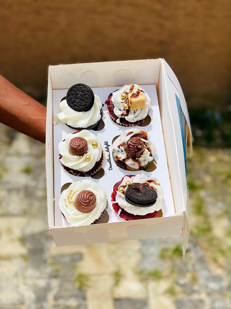Box of luxury cupcakes with chocolate, oreo and gold pearls